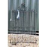 A wrought iron garden gate, 185cm high, 117cm wide