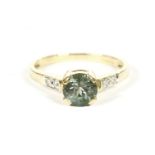 An 18ct gold single stone Alexandrite ring with diamond set shoulders, finger size N, accompanied by