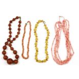 A single row graduated toffee coloured Bakelite bead necklace with bronzed coloured bead spacers,