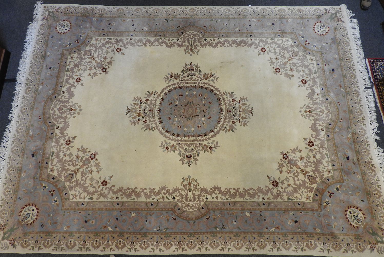 An Indian ivory ground carpet, with central pale blue medallion with conforming border, 364cm x - Image 2 of 4