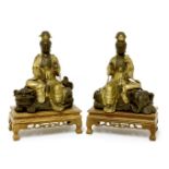 A pair of Chinese parcel gilt bronze bodhisattva, 20th century, one seated on an elephant, holding a