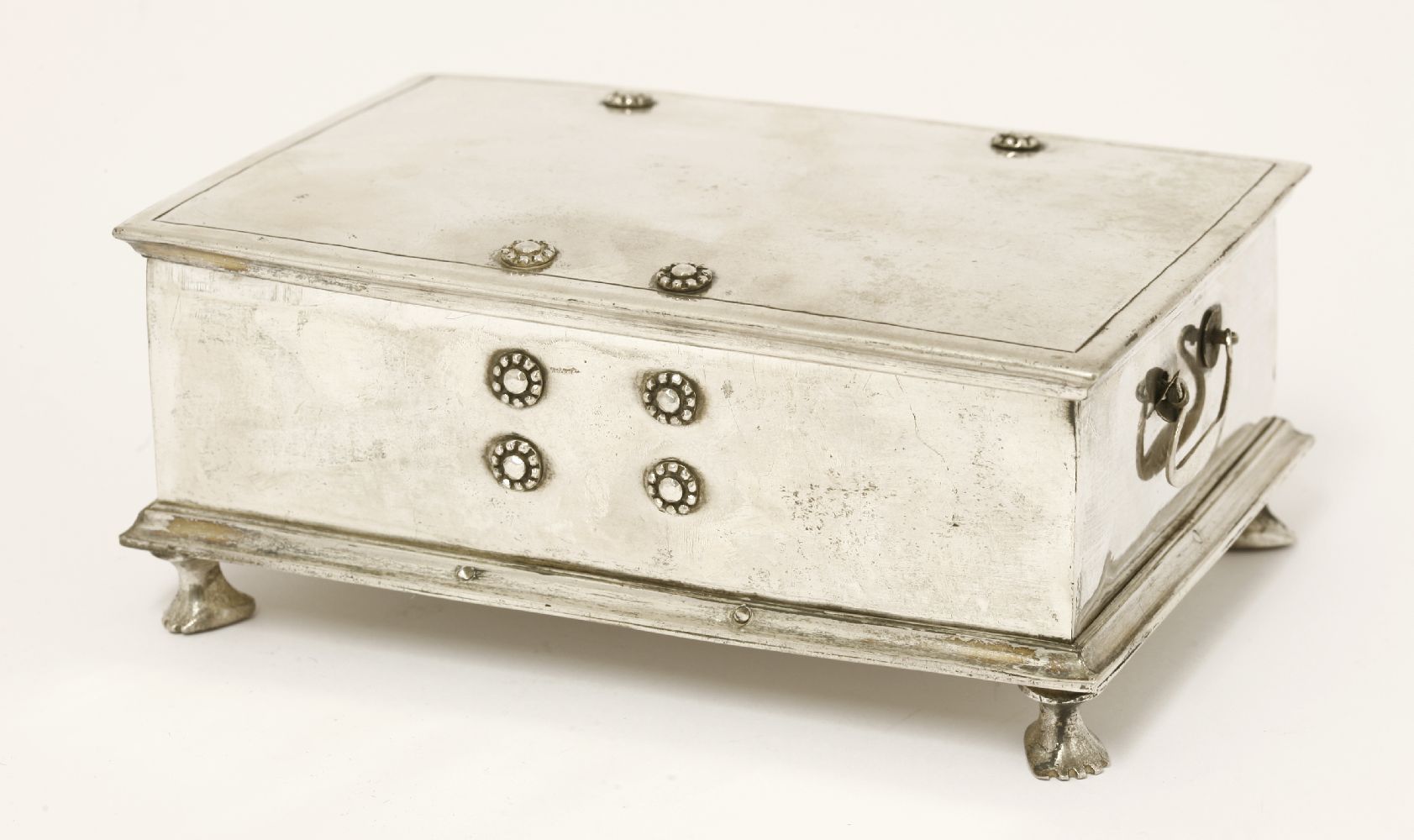 A Thai silver box and hinged cover, late 19th century, of rectangular form with loop handles, on