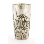 A Japanese silver beaker,c.1900, of tapering cylindrical form, decorated with irises and leaves