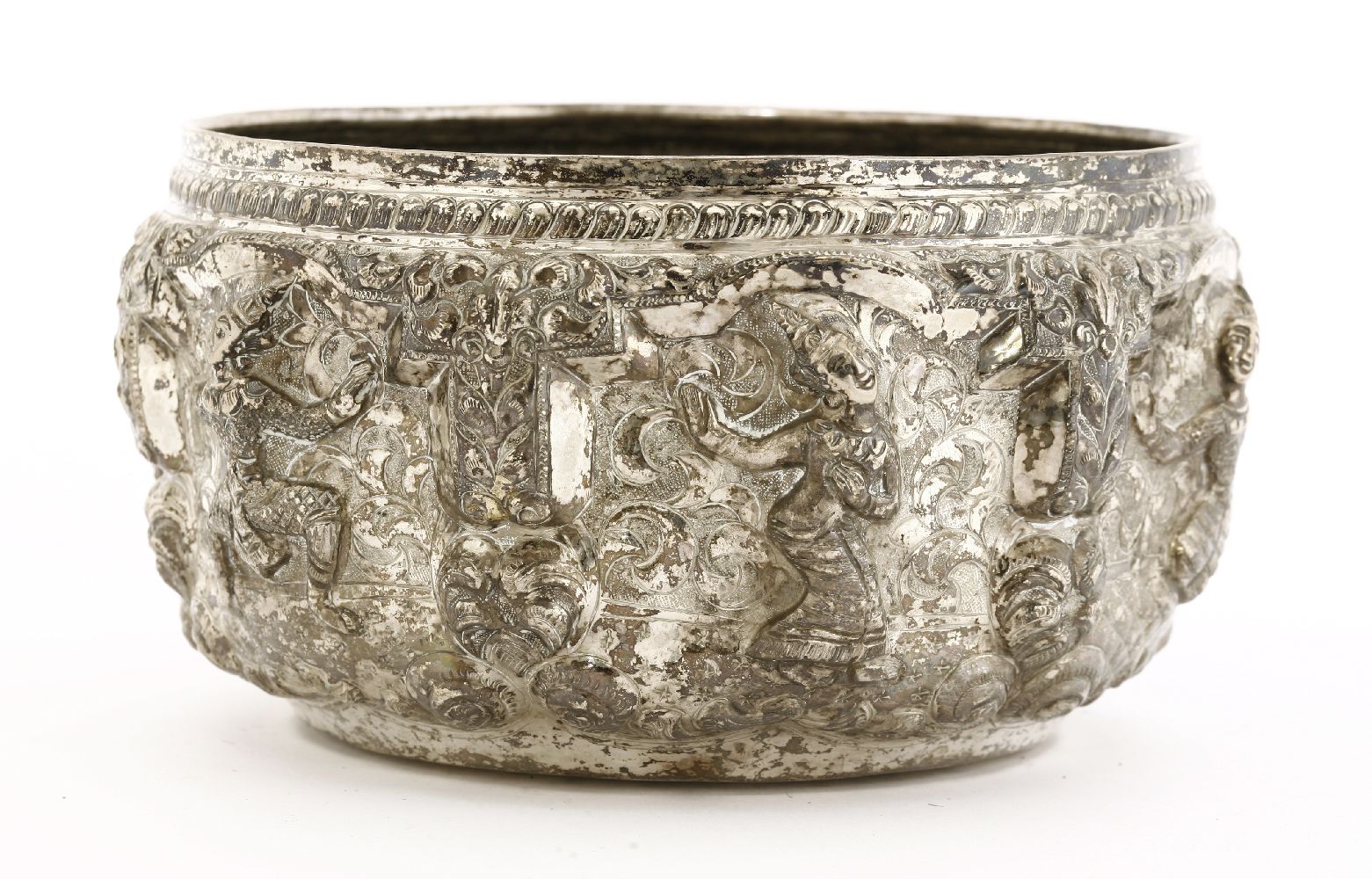 A Thai silver bowl,19th century, decorated in relief with dancing figures between columns, under - Image 2 of 3