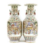 A pair of Chinese Canton enamelled vases,mid-19th century, each of cylindrical form with a flared