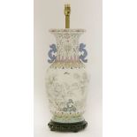 A famille rose vase,late 19th century, painted with white peony beside a rock with insects flying