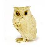 A Japanese ivory okimono,Meiji period (1868-1912), of an owl, feathers incised in details and with