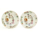 A pair of Chinese famille rose plates, Jiaqing (1796-1820), of stepped circular form, painted with