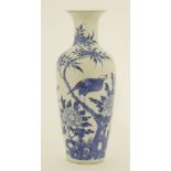 A Chinese blue and white vase,Guangxu (1875-1908), painted with a bird standing on a peach blossom