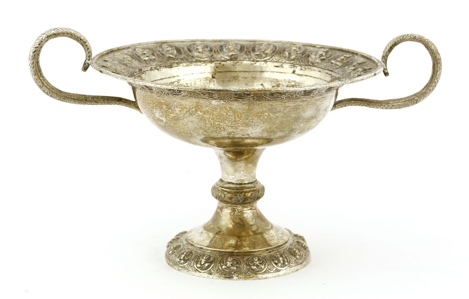 An Indian silver tazza, of circular form on a circular base, the border with impressed deities,