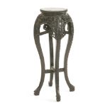 A Chinese hardwood vase stand,late 19th century, the circular top with a beaded border inset with
