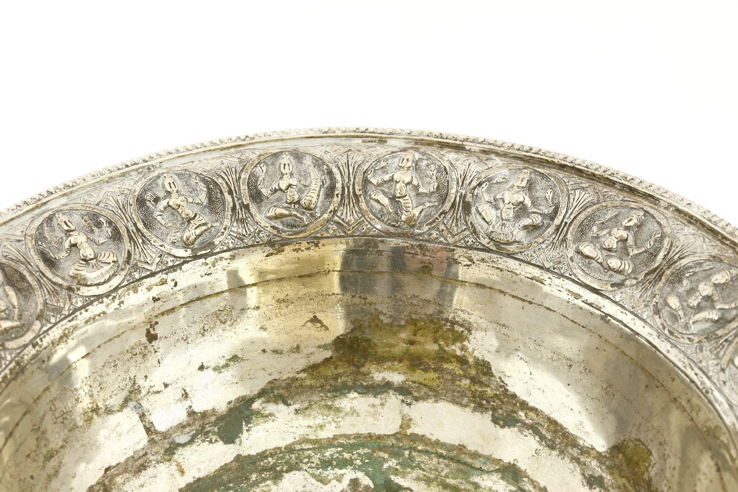 An Indian silver tazza, of circular form on a circular base, the border with impressed deities, - Image 2 of 3