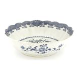 A Chinese blue and white bowl, late 18th century, of lobed circular form, the centre painted with