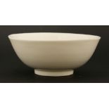 A Chinese blanc de Chine bowl,17th century, of circular form on a circular base, thickly potted,