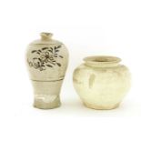A Chinese pot,Tang dynasty (618-907), of globular form under a white glaze,18cm, anda Cizhou ware