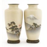 A pair of Japanese cloisonné vases,c.1920, by Ando Cloisonné Company, each with a landscape of