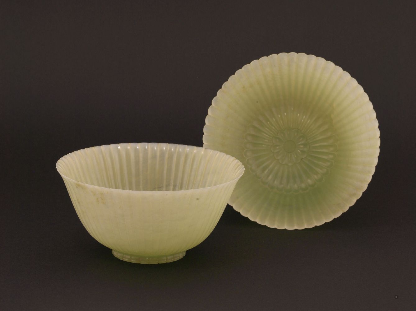 A pair of Chinese pale celadon jade chrysanthemum 'Lindsay' bowls, Jiaqing (1796-1820), each with