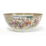 A Chinese Canton enamelled punch bowl,18th century, painted with ladies and boys in a garden in