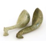 Two pieces of Chinese earthenware, Han dynasty (206 BC-AD 220), two lead-glazed spoons with dragon