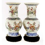 A pair of Chinese famille rose vases, each of baluster shape with a flared mouth, painted with Fu,