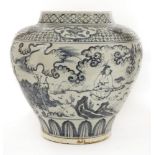 A Chinese blue and white jar,painted with figures listening to music in a garden, between a diapered