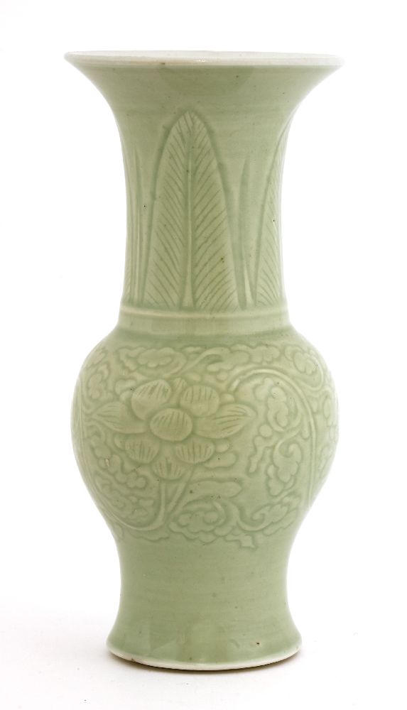 A Chinese celadon vase,Kangxi (1662-1722), of baluster shape with a flared mouth, incised with