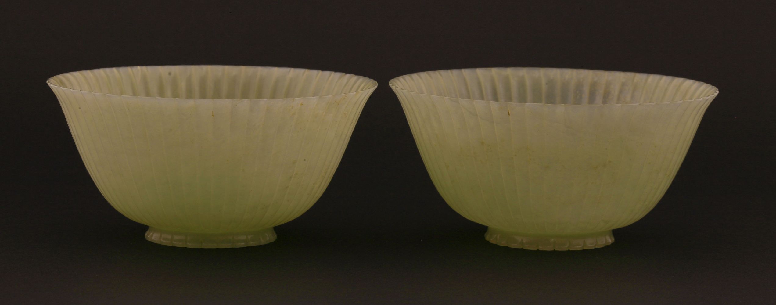 A pair of Chinese pale celadon jade chrysanthemum 'Lindsay' bowls, Jiaqing (1796-1820), each with - Image 8 of 14