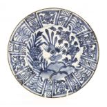A Chinese blue and white dish,late Ming dynasty, painted in the Kraak style with a bird on