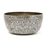 A Thai silver niello bowl,19th century, of circular form on a flat base, the body decorated with