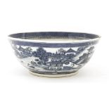 A Chinese blue and white bowl,19th century, painted with a continuous landscape of a river,