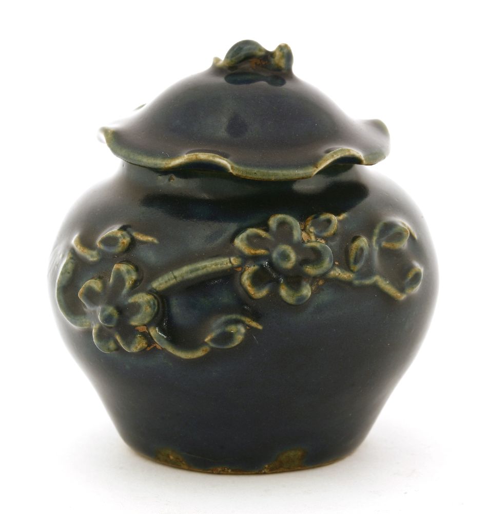 A Chinese blue jar and cover, Yuan dynasty (1279-1368), with an applied blossoming branch, the cover