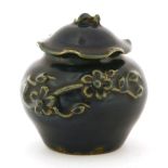 A Chinese blue jar and cover, Yuan dynasty (1279-1368), with an applied blossoming branch, the cover