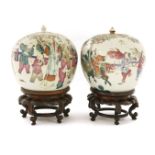Two Chinese famille rose jars and covers, c.1900, each of globular form, painted with boys at play
