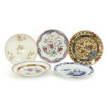 A collection of Chinese plates, 18th century, comprising two famille rose, a blue and white example,