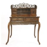 A Chinese writing desk,19th century, the pierced and carved key fret gallery above two drawers,