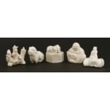 A collection of Chinese blanc de Chine water droppers,18th century, of a Budai, a Buddhist lion, a