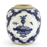 A Chinese blue and white ginger jar, Kangxi (1662-1722), painted with precious objects in shaped