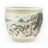 A Chinese famille rose fish bowl,painted with the One Hundred Boys celebrating in a garden in a