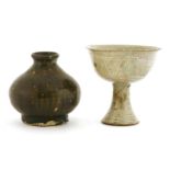 A Korean Buncheong stoneware stem cup, with incised decoration of flowers and crossed lines to