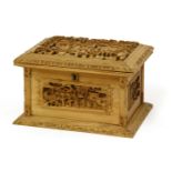 A Chinese Canton sandalwood box with hinged cover, late 19th century, each side carved with