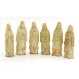 A collection of six figures,Tang dynasty (618-907), modelled as officials, all with their hands