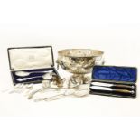 A silver plated punch bowl, with embossed detail together with a punch ladle and a collection of