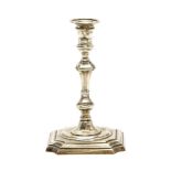 A George III style silver taper stick, London, 1895, turned column support and square base, makers