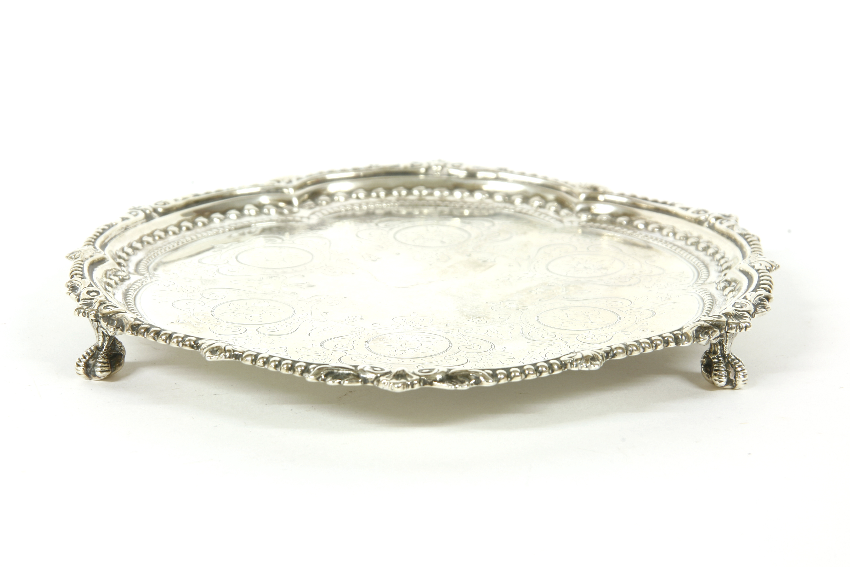 A Victorian silver salver, by Richard Martin and Ebenezer Hall, (probably) London 1881, with three