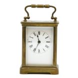 A French brass carriage clock, with white enamel dial, 14cm high