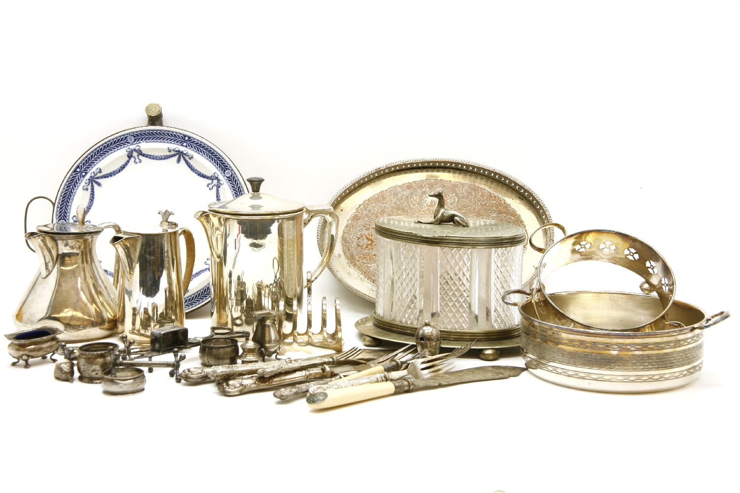 Silver plate, including an oval glass biscuit barrel with greyhound finial, small silver items,