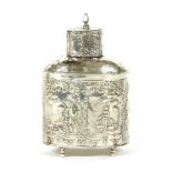 A Dutch silver tea caddy, of oval form, decorated all over with chased and engraved pastoral scenes,