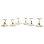 Three pairs of early 20th century silver dwarf candlesticks, 9cm high (6)