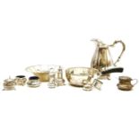 A silver condiment set, a sauce boat, two silver napkin rings, a sugar caster, further plated dishes