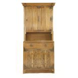 A Continental Arts & Crafts oak bookcase, with an hinged and panelled folding upper section with